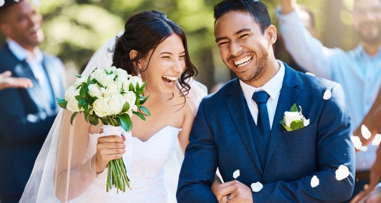 a happy groom and bride just married at a wedding